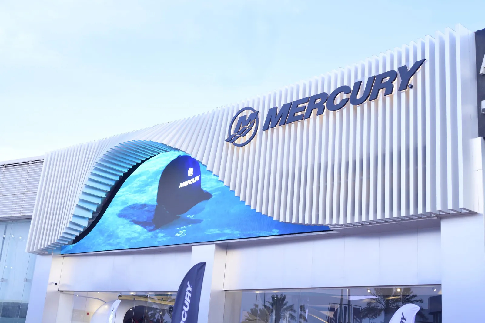 Close view of Mercury facade LED wave and signage, daylight