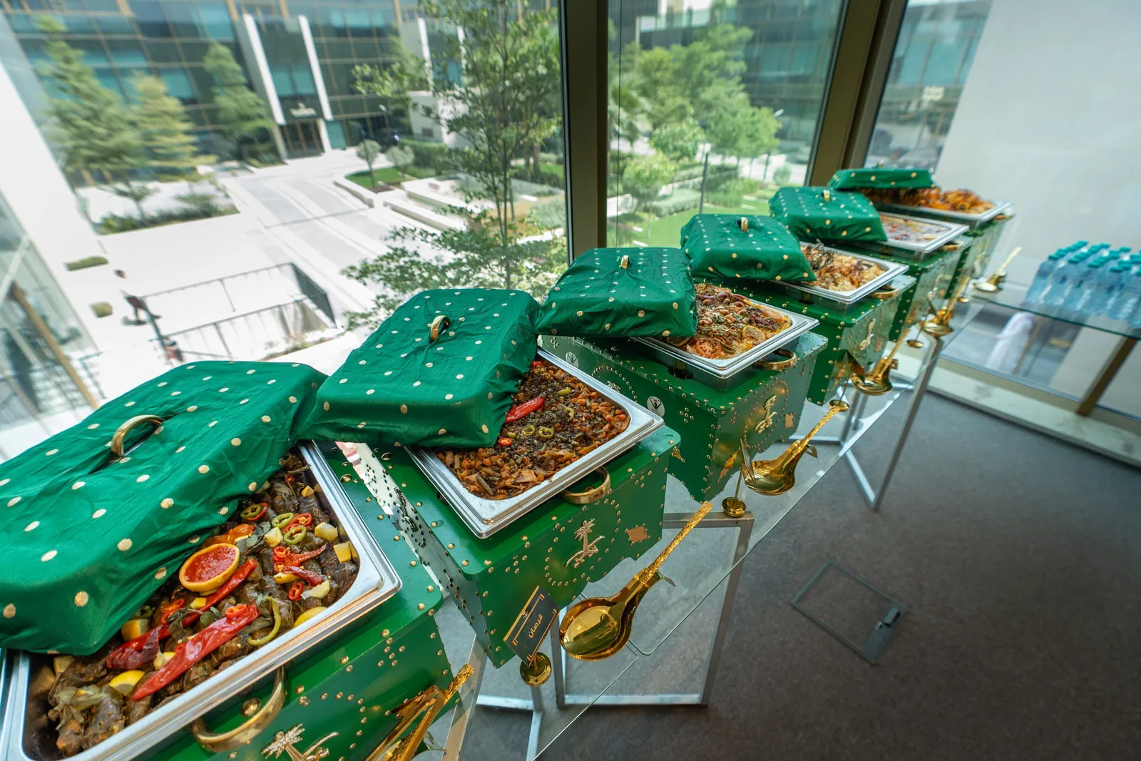 Green-and-gold National Day chafing dishes with embroidered covers