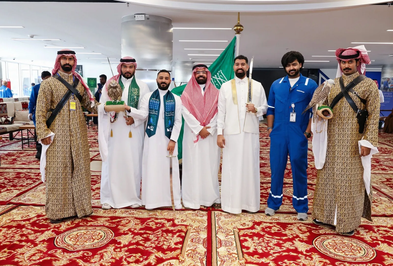Guests with falconers, swords and flag