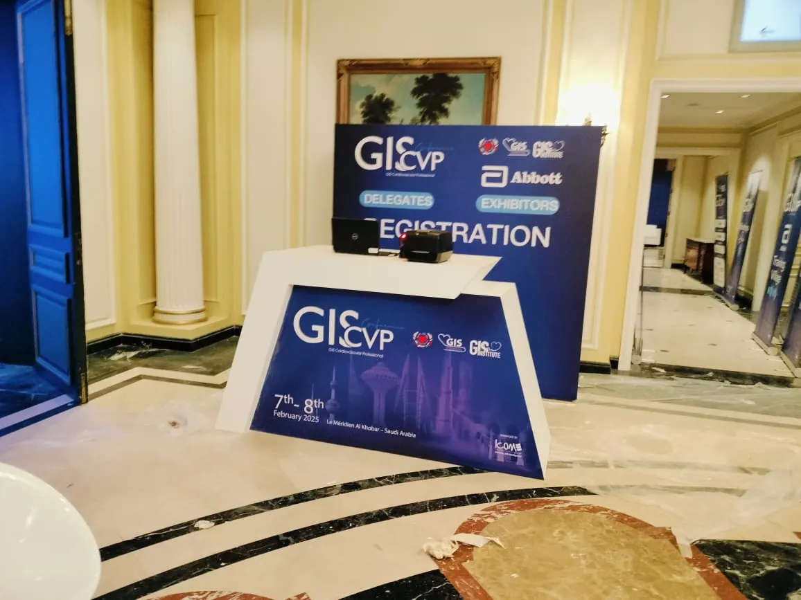 Branded registration counter and backdrop for a conference exhibition area