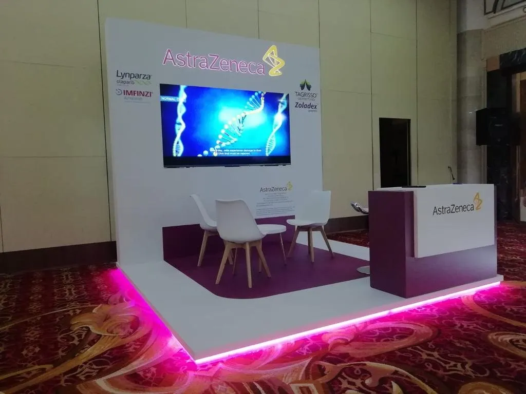 AstraZeneca booth with pink LED edge