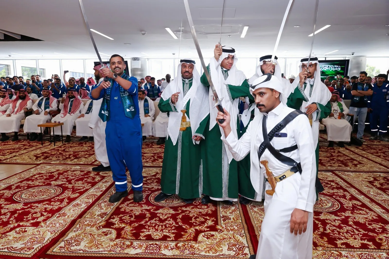 SLB employee in coverall joins sword dance, grinning